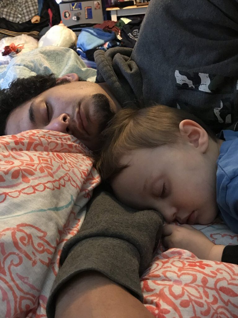 Sleeping father and baby